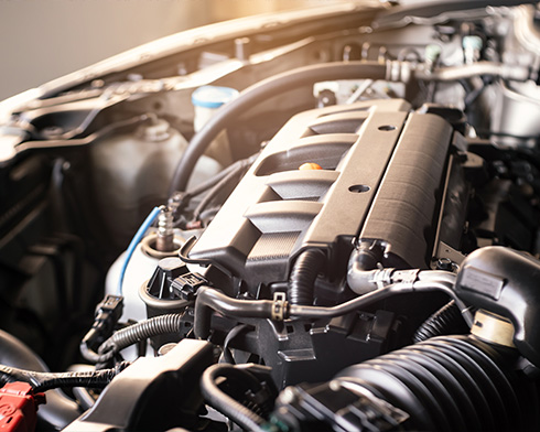 a close up of a combustion engine in a petrol or diesel car